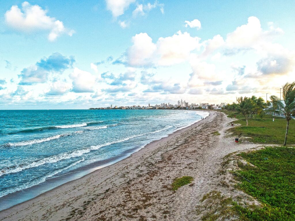 pexels-photo-899186-899186 A serene view of Intermares beach in Brazil with waves and clear blue sky.